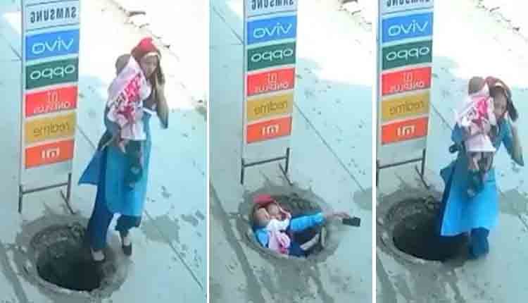 Woman fell into open manhole with her baby 2