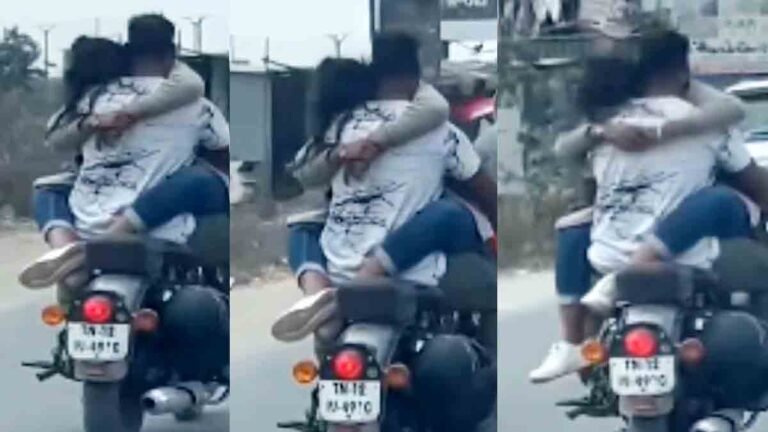 "A young couple romantically riding a bike on Sarjapur Road, Bangalore."