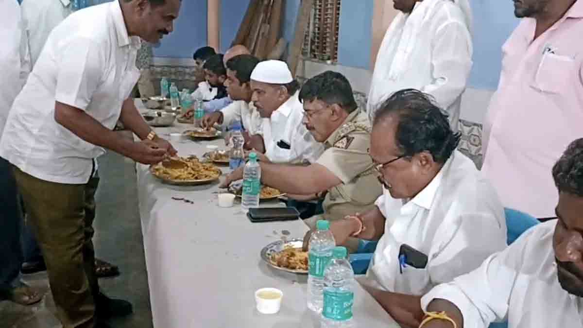Ramzan - Hindu and Muslim community members sharing an Iftar meal in Gudibande, promoting communal harmony during Ramadan