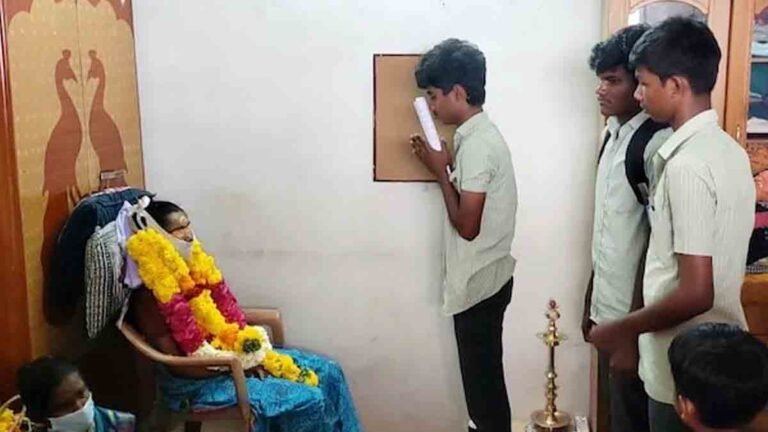 "A Tamil Nadu student with teary eyes, sitting in an exam hall after his mother’s sudden death."