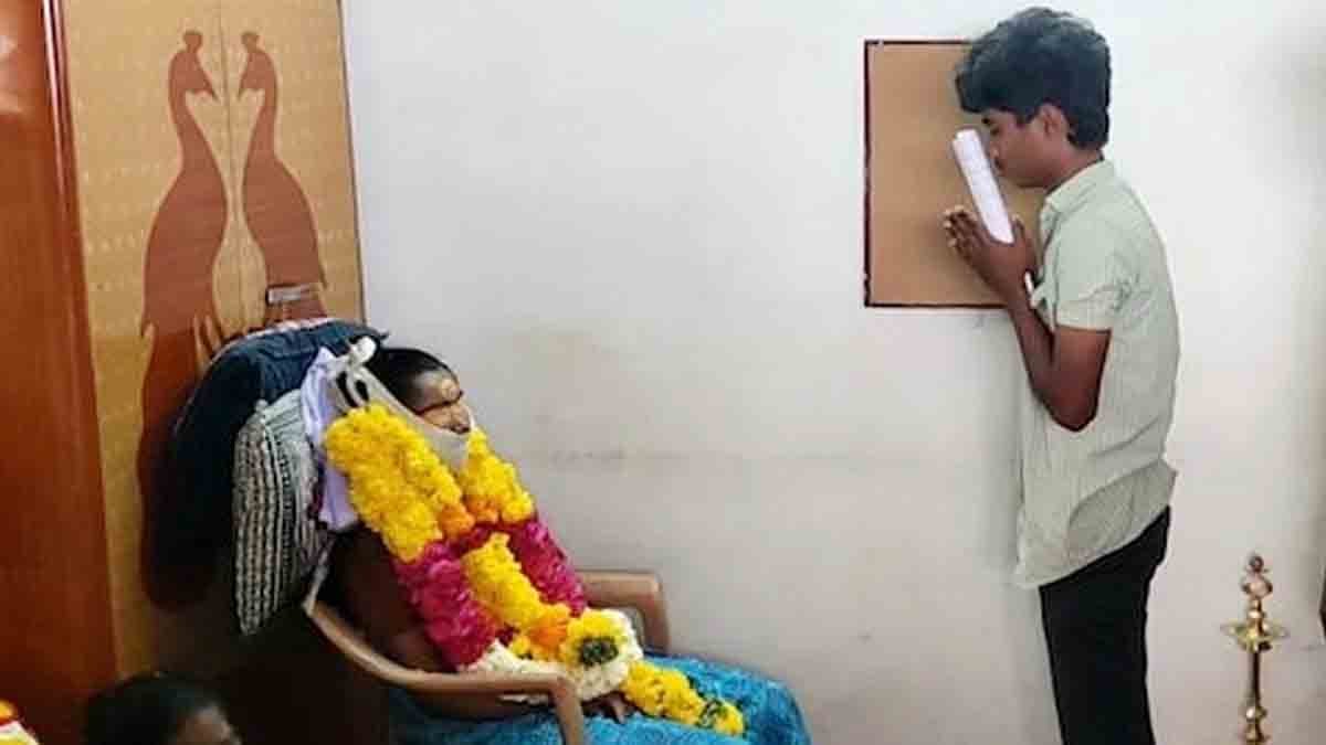 "A Tamil Nadu student with teary eyes, sitting in an exam hall after his mother’s sudden death."