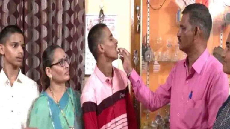 SSLC Results- Abhishek, a student from Bagalkote, smiles with his parents after failing in all six SSLC subjects and receiving their support with a cake celebration