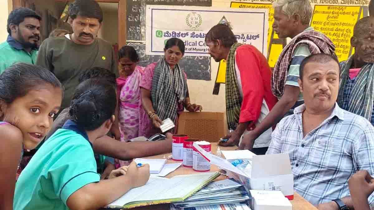 Health professionals conducting free medical check-ups at Gudibande health camp