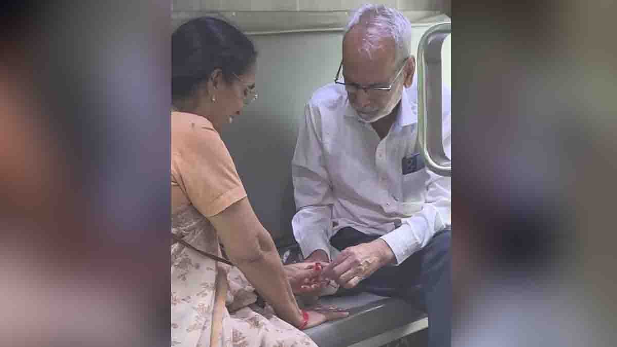 Old Couple - Elderly man lovingly applying nail polish to his wife’s fingers on a train – viral heartwarming moment of true love