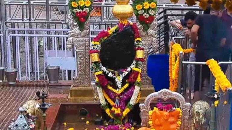Lord Shani idol being worshipped with mustard oil at a temple on Saturday