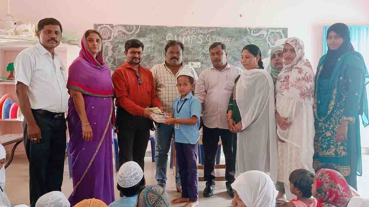 Students receiving educational materials at a Government Urdu School event in Gudibande, Karnataka, as Karnataka Urdu Academy President Mohammad Naseer addresses issues of declining admissions