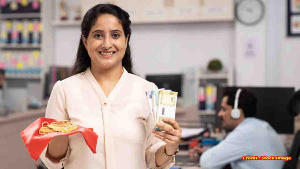 Gold Loan - Indian woman giving gold jewelry for loan at bank counter