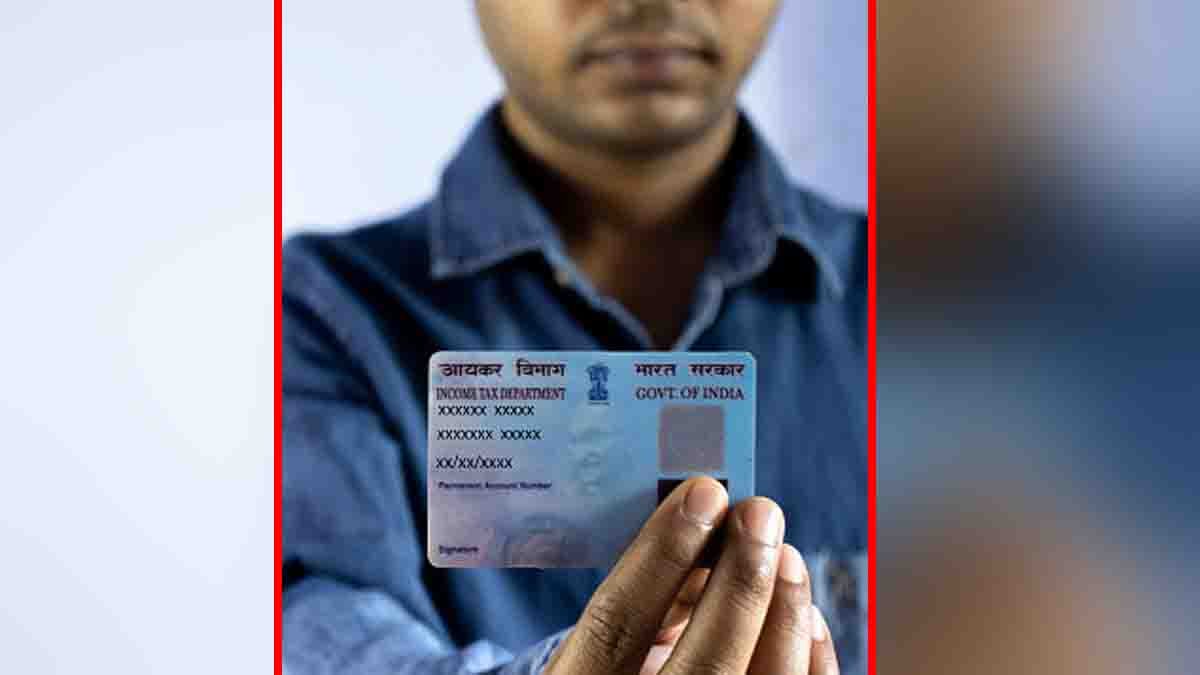 A woman in India updating her PAN card photo change online using a laptop at home with ID documents on the table