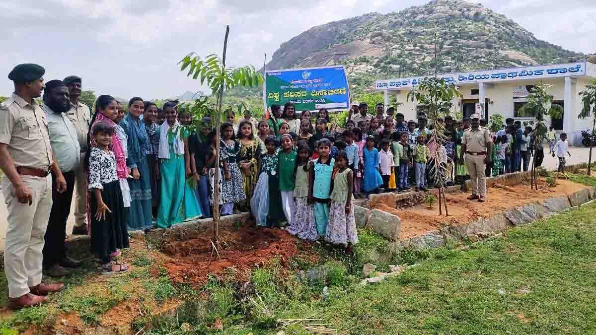 World Environment Day celebration at New Public School, Gudibande – students and teachers planting saplings with Forest Department officers to promote environmental awareness
