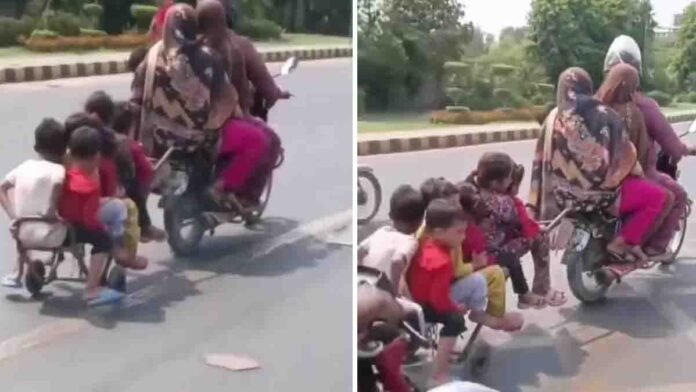 10 people including children dangerously traveling on a bike with a homemade trailer - viral video raising road safety concerns