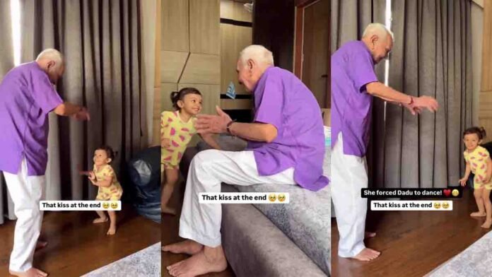 Little girl dancing joyfully with her grandfather and gently massaging his hands and feet, showing deep love and family bonding Video viral