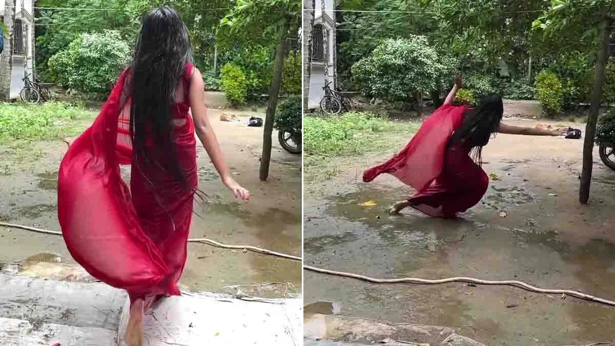 Indian girl in red saree slips while dancing in wet courtyard while making a viral Instagram Reels