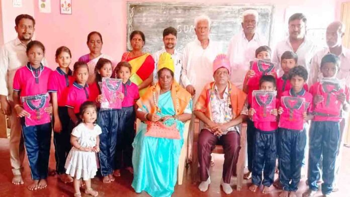 Social worker Ananth Kumar and wife distribute free tracksuit to government school children in Gudibande, Chikkaballapur
