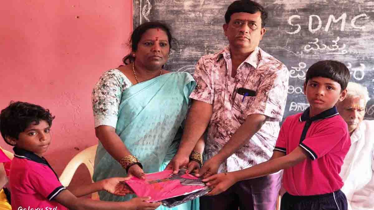 Social worker Ananth Kumar and wife distribute free tracksuit to government school children in Gudibande, Chikkaballapur