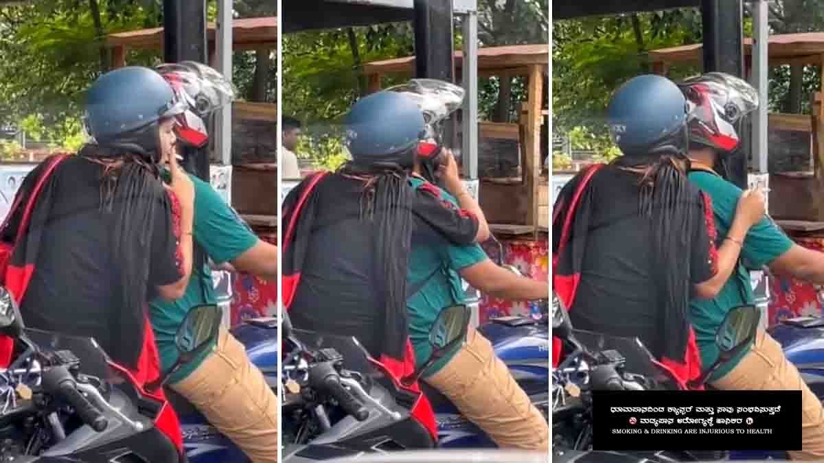 Indian woman sitting on a motorbike behind her husband, smoking a cigarette and handing it to him at a traffic signal, viral video moment