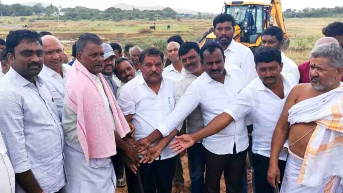 MLA S.N. Subbareddy performs Bhoomi Pooja with villagers present for ₹20 lakh canal construction project in Nuligumba village, Gudibande taluk, Karnataka - Local News