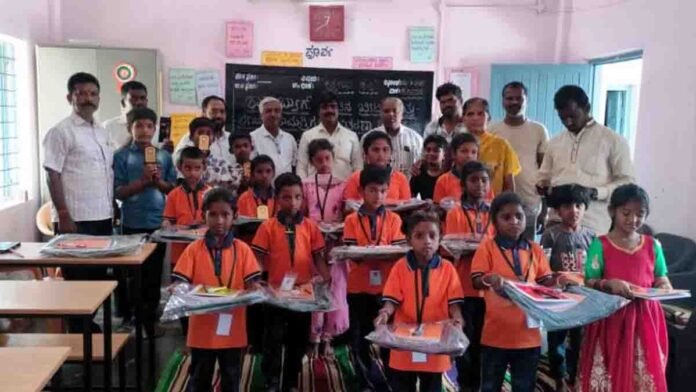 Donors distributing educational materials to students at Upparahalli Government School in Gudibande, Chikkaballapur district - Local News