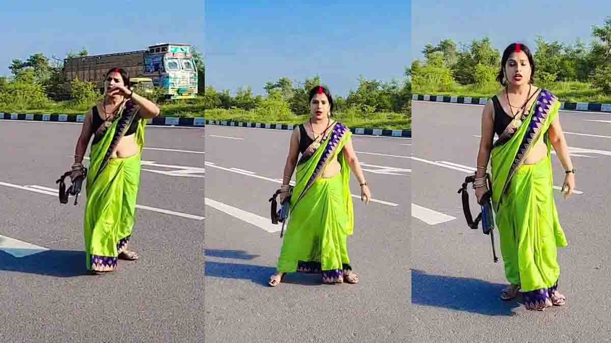 Girl holding pistol for Instagram reel on NH-34 in Kannauj