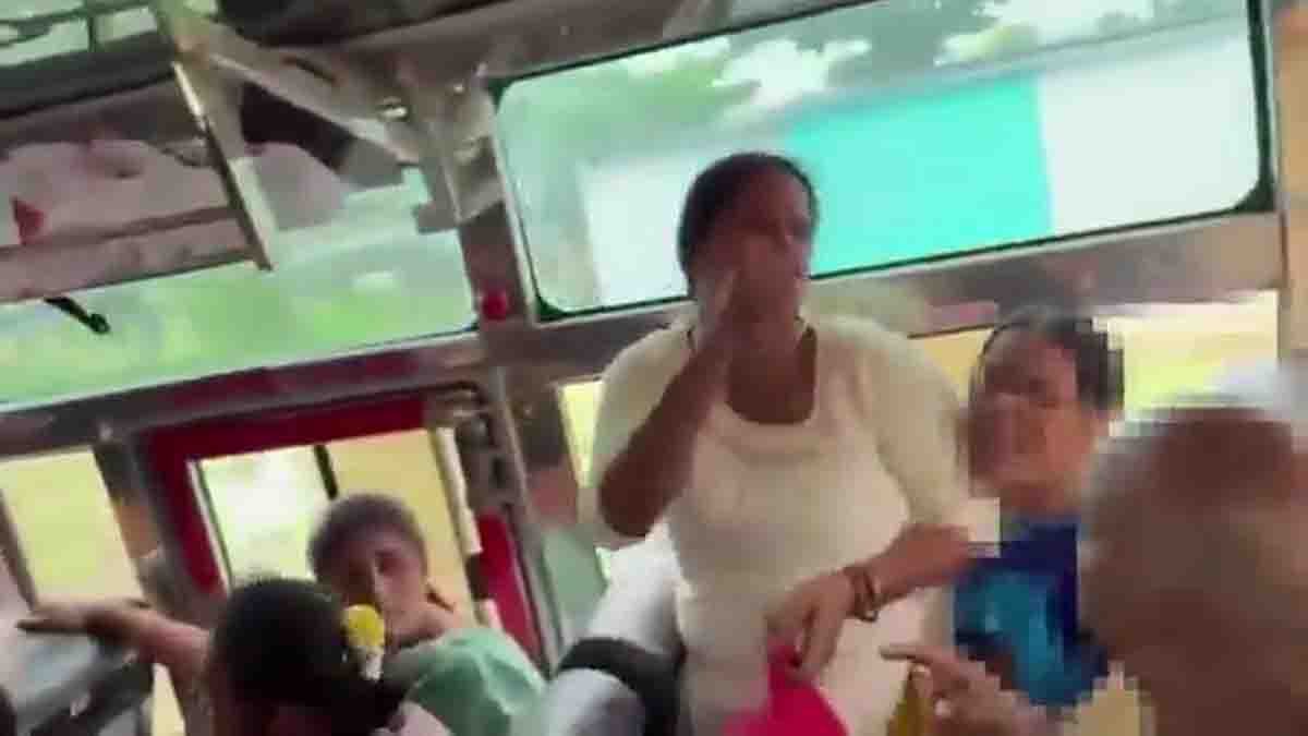 Woman hitting man with slipper during bus seat fight in Andhra Pradesh - Video