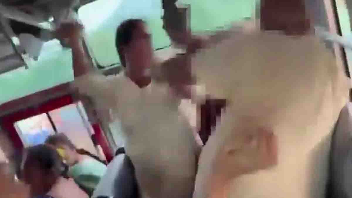 Woman hitting man with slipper during bus seat fight in Andhra Pradesh - Video