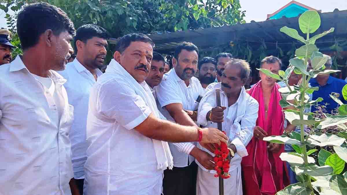MLA S.N. Subbareddy performing Bhoomi Pooja for new Gram Panchayat building in Thirumani village, surrounded by villagers and officials during a development program in Gudibande, Karnataka- Local News