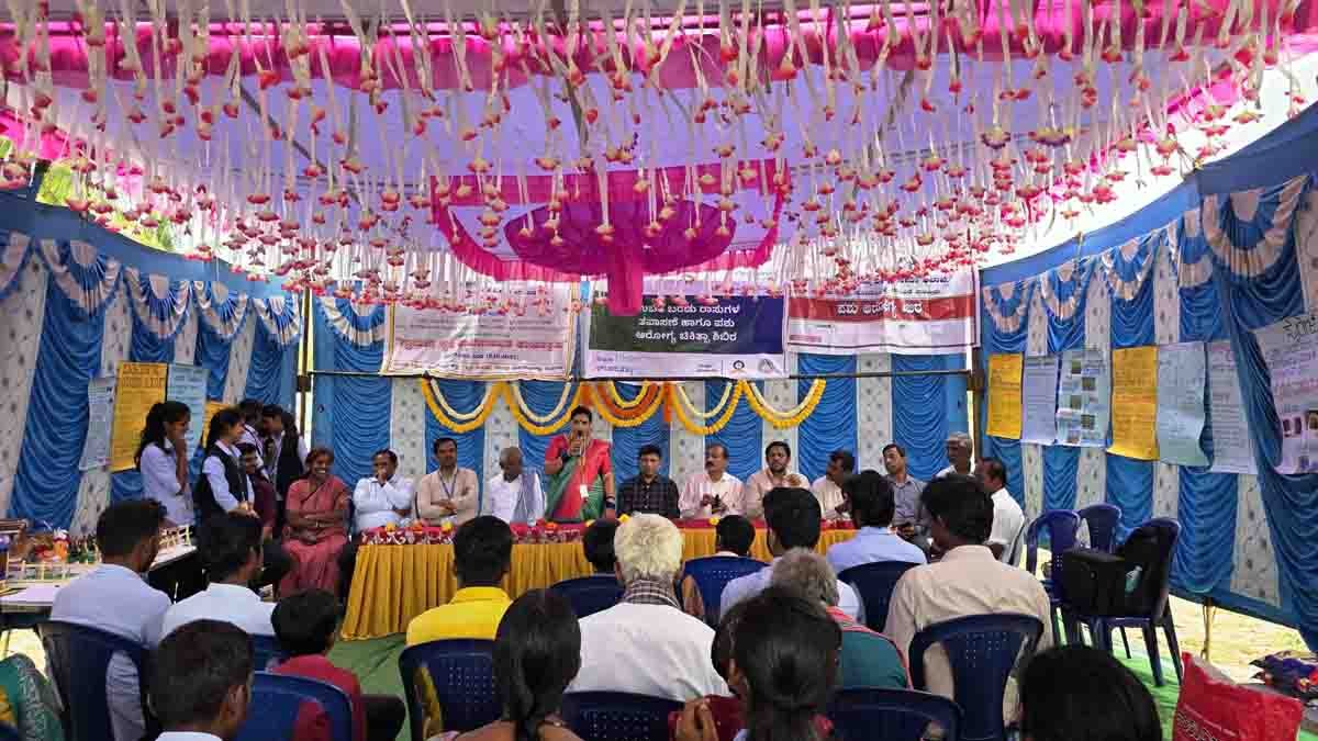 Farmers with cattle receiving free veterinary treatment during dairy farming awareness camp in Chikkaballapur
