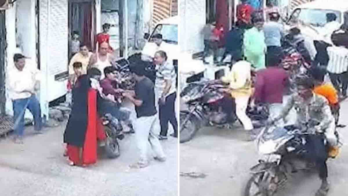 Angry family members beating a youth in Dhar district after he gave a flying kiss to a girl — viral street fight in Madhya Pradesh - video