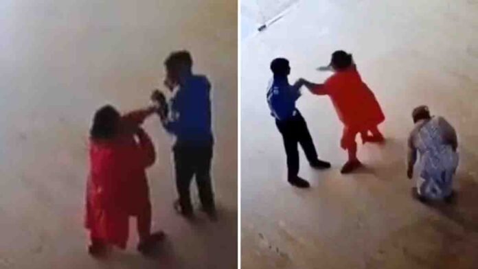 Woman Assaults Security Guard in Noida Viral Video 1 Red saree-clad woman attacking security guard at Noida society captured on CCTV Video