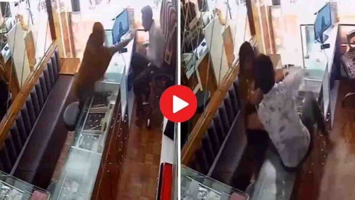 CCTV footage showing Ahmedabad jewellery shop owner slapping woman during robbery attempt, viral video spreads on social media.