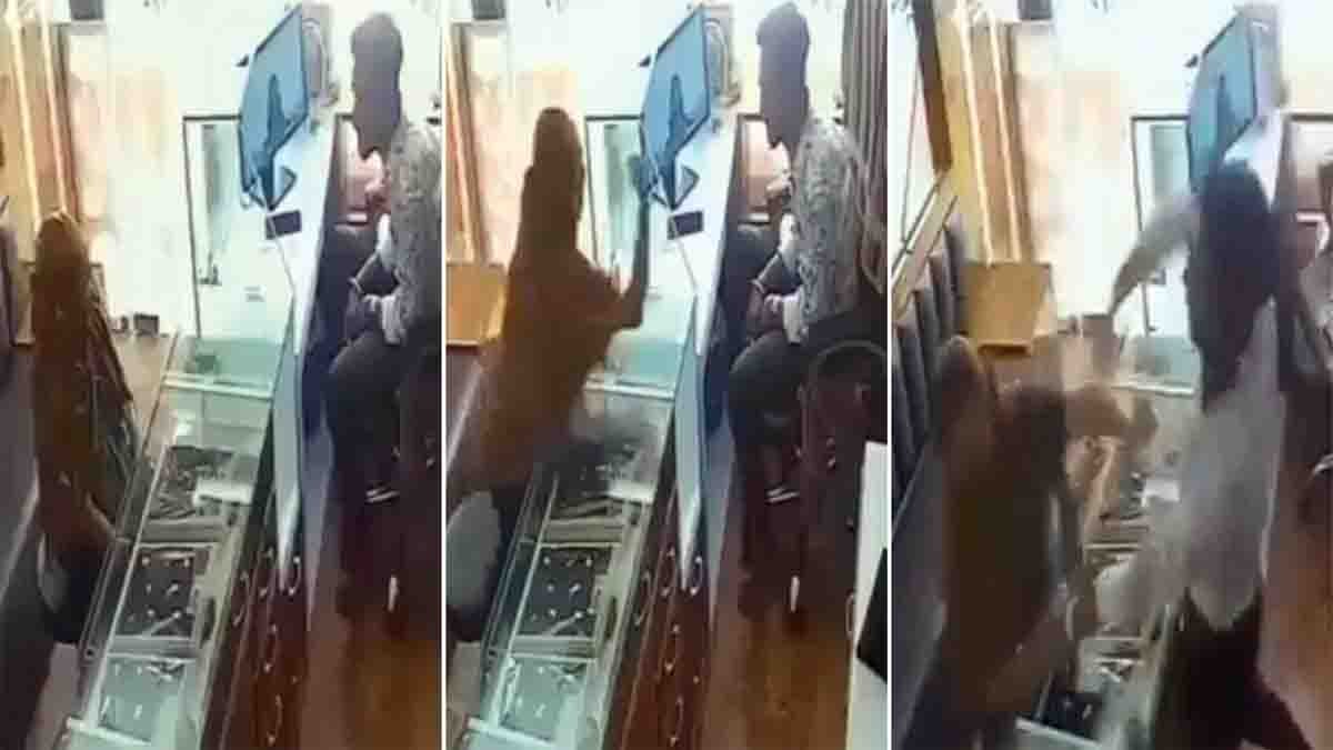 CCTV footage showing Ahmedabad jewellery shop owner slapping woman during robbery attempt, viral video spreads on social media.