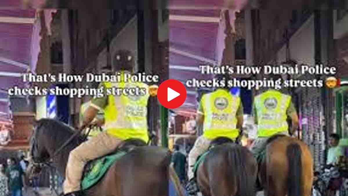 Dubai Police officers patrolling on horses through busy night market in Dubai