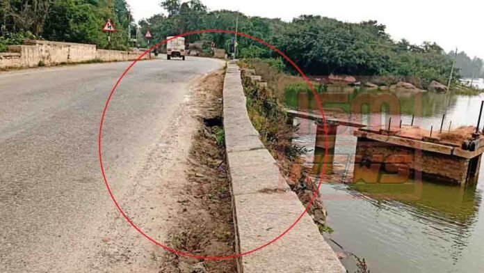 Gudibande Lake bund collapse showing damaged Amani Bairasagara embankment and risky roadway for motorists