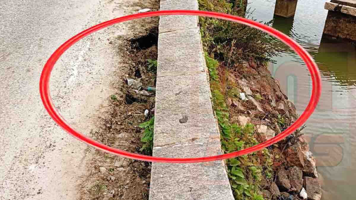 Gudibande Lake bund collapse showing damaged Amani Bairasagara embankment and risky roadway for motorists