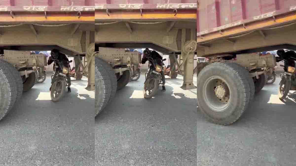 Traffic : ಟ್ರಾಫಿಕ್ ಜಾಮ್ನಲ್ಲಿ 5 ನಿಮಿಷ ಕಾಯಲು ಆಗದೆ ಇವನೇನು ಮಾಡಿದ ನೋಡಿ! ವಿಡಿಯೋ ವೈರಲ್...! 1 Reckless Biker Rides Under Truck During Traffic Jam in Bihar – Viral Video Shocks Internet