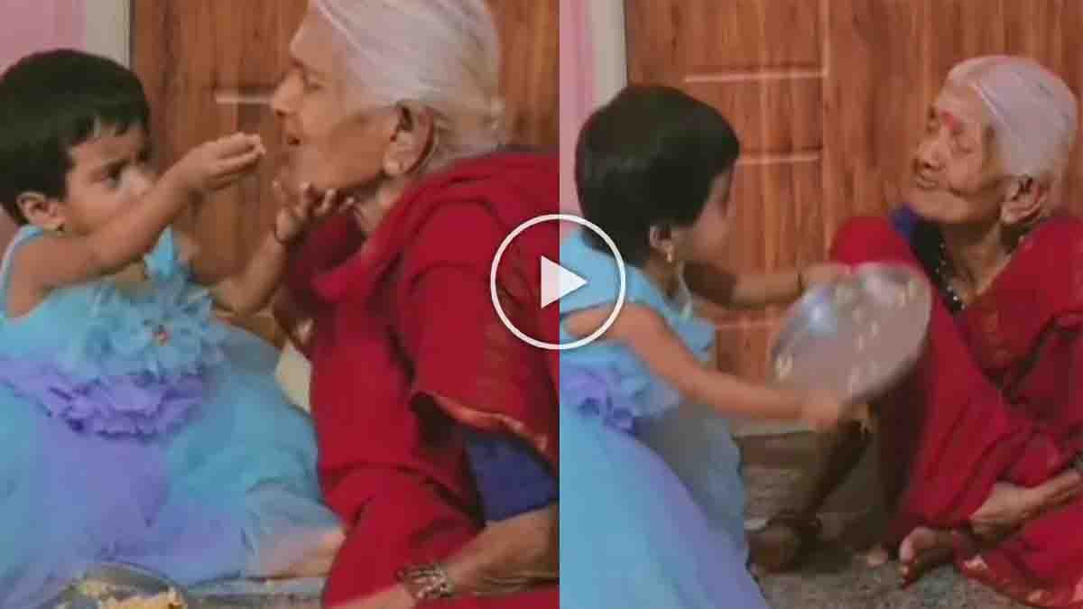 Grandmother smiling while her little granddaughter feeds her lovingly - Viral Video