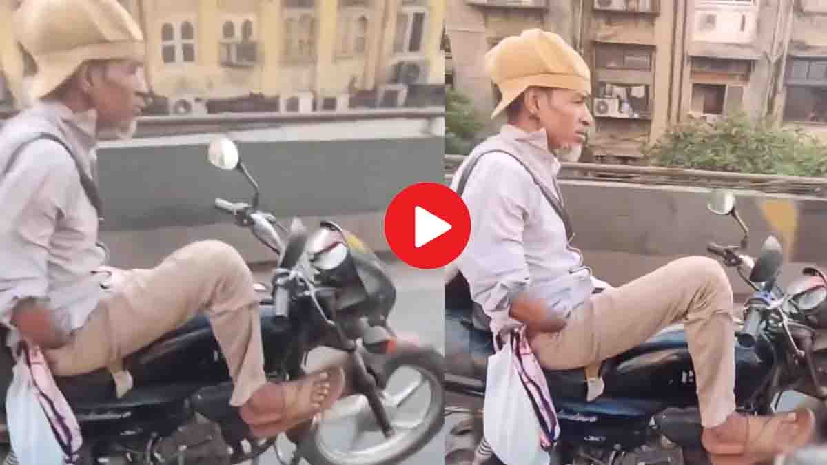 Physically challenged man without hands rides a bullet bike at high speed on the road, showing courage and confidence