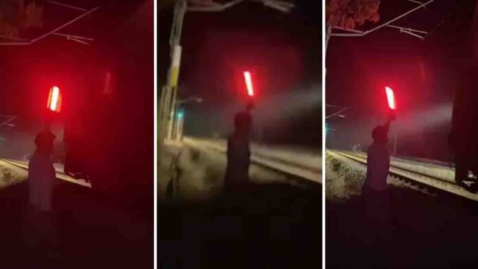 Two students in Kerala illegally stopping a moving express train by showing a red signal for an Instagram Reel