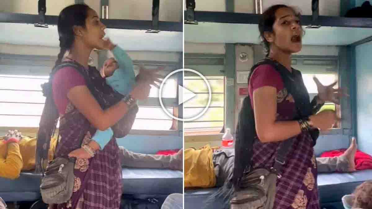 Mother holding her baby and singing a patriotic song inside an Indian train in a viral video
