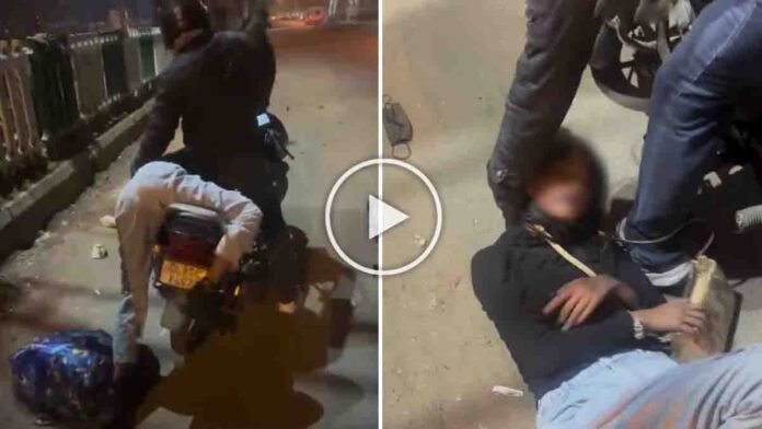 Rapido bike rider saving an intoxicated woman who slipped off the bike on a Delhi road at night, viral video