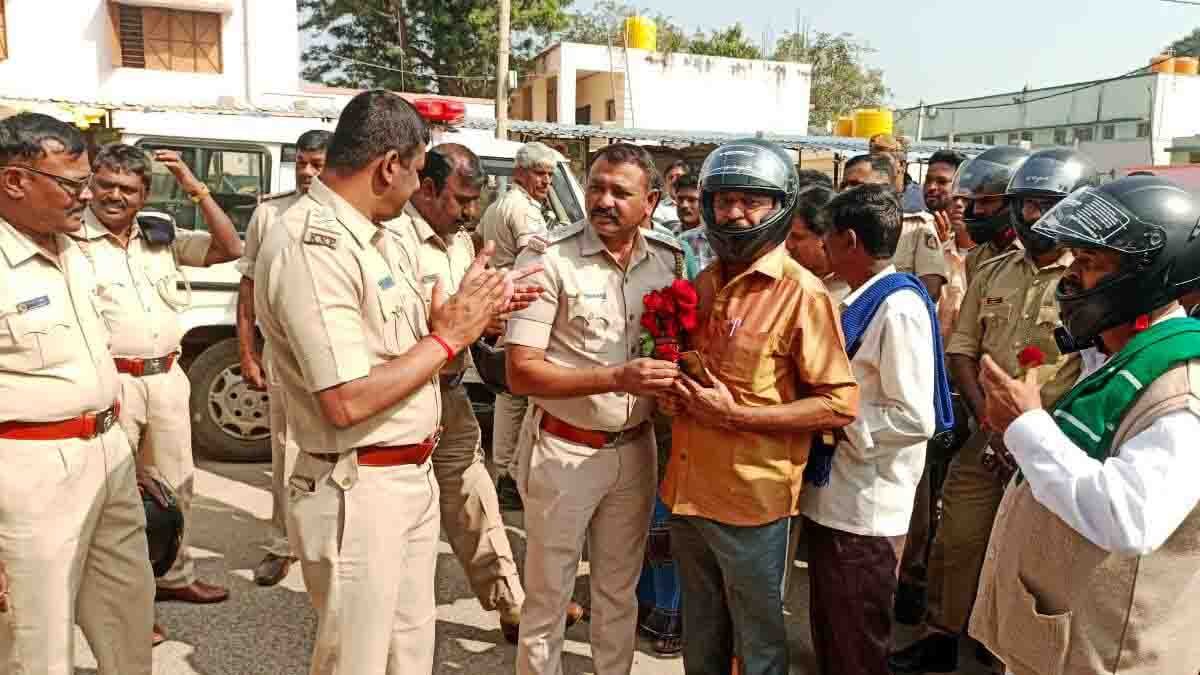 Gudibande Police organized a bike rally from Peresandra to Gudibande to promote helmet awareness, distributing roses instead of fines and urging two-wheeler riders to follow road safety rules