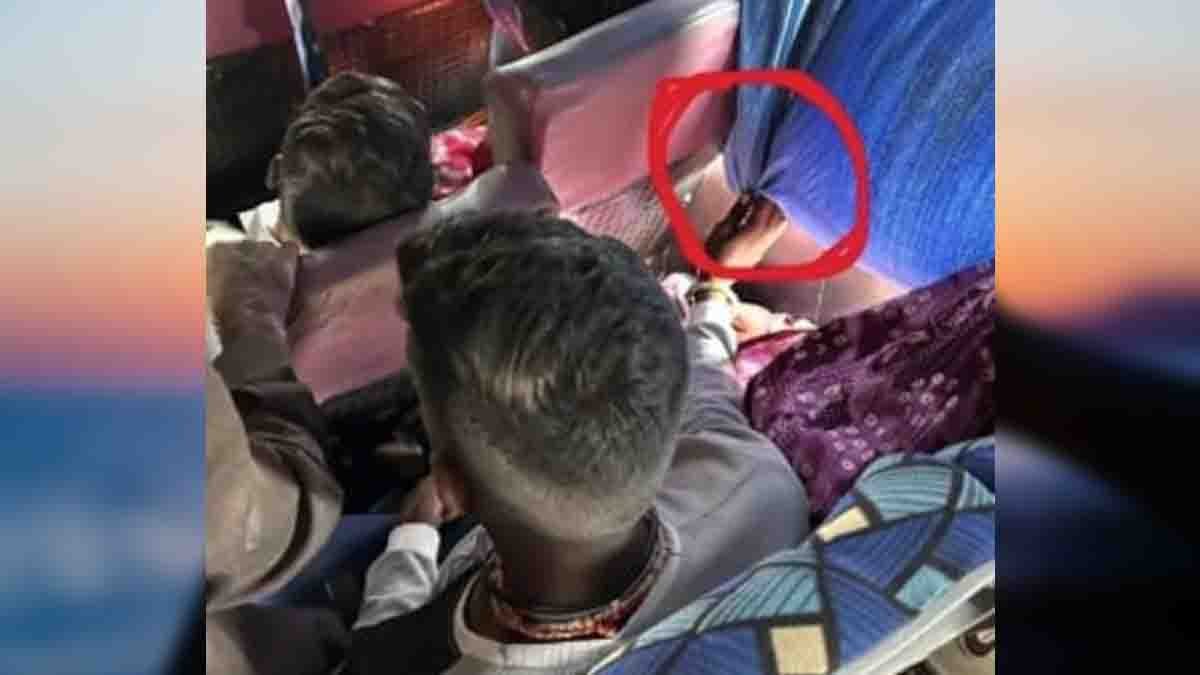 Indian husband holding window curtain for 40 minutes to protect sleeping wife from sunlight on bus – true love viral photo