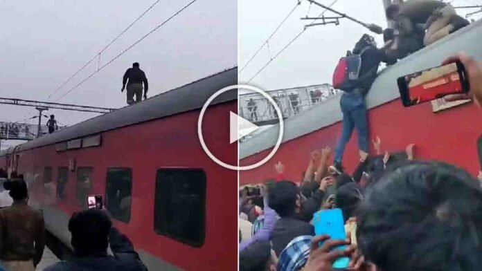 RPF jawan climbing a train roof to rescue a man before he touches overhead high-voltage wires at Mauhar Phatak railway station - Viral Video