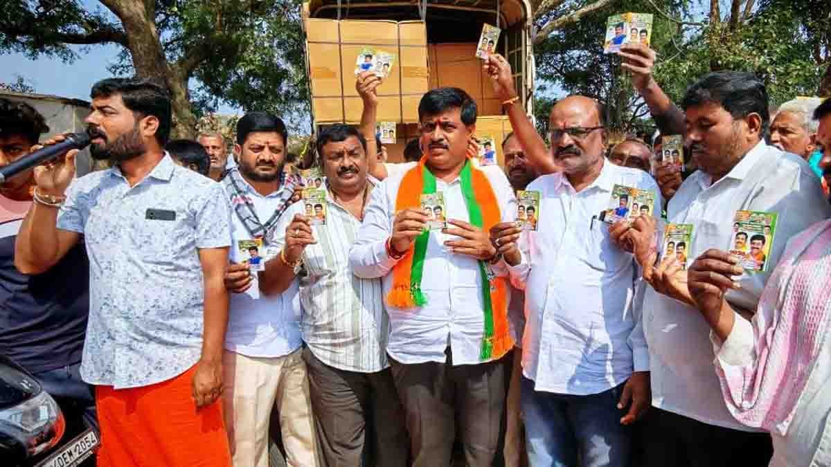 BJP leader C. Muniraju leads a free helmet distribution drive in Gudibande taluk to promote road safety and compulsory helmet use
