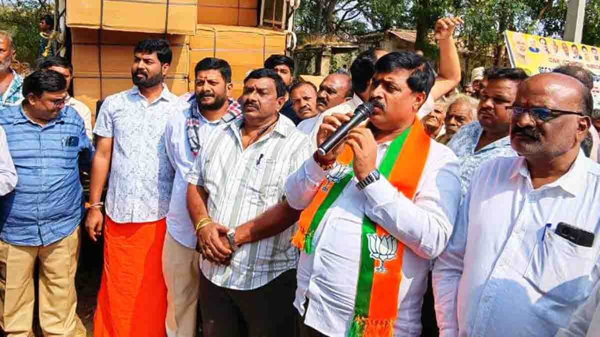 BJP leader C. Muniraju leads a free helmet distribution drive in Gudibande taluk to promote road safety and compulsory helmet use