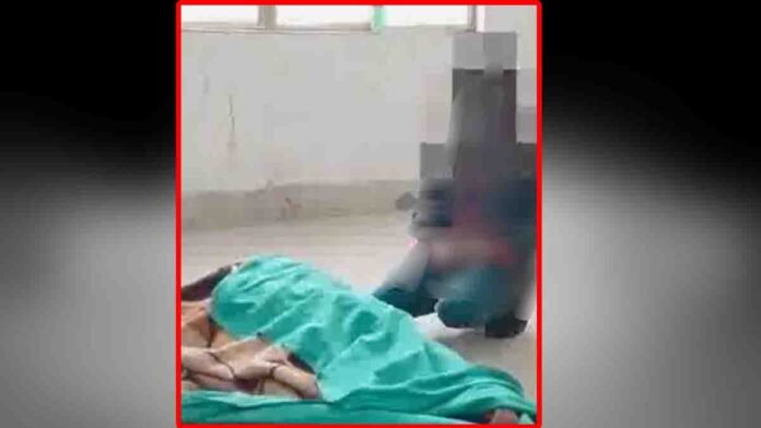 A heartbreaking moment as a 10-year-old boy sits beside his mother’s body in a government hospital in Etah, Uttar Pradesh