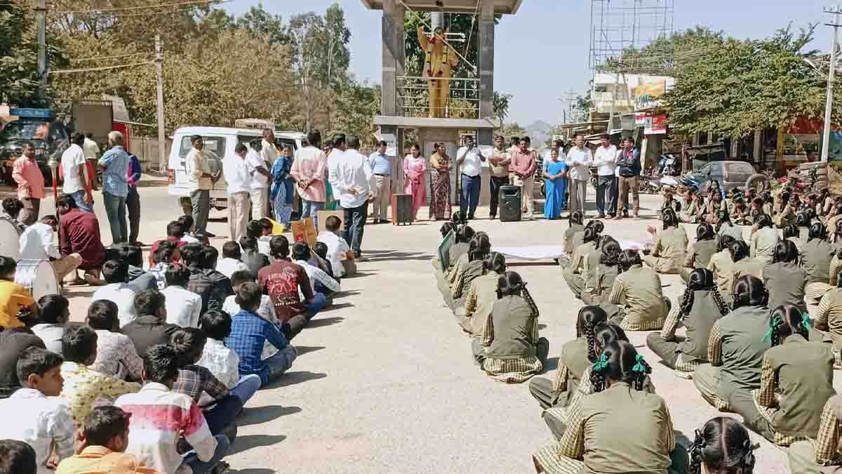 Students and officials participate in a road safety and traffic rules awareness rally in Gudibande, Chikkaballapur