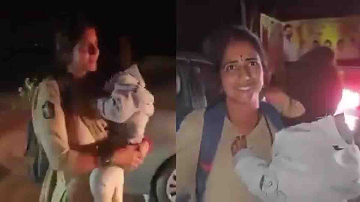 Andhra Pradesh woman police constable Jayashanti managing traffic while holding her child to clear way for an ambulance