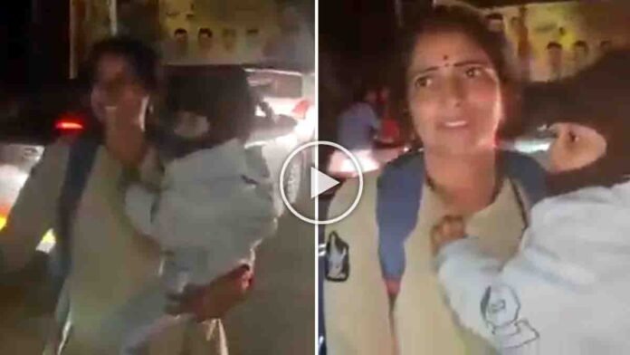 Andhra Pradesh woman police constable Jayashanti managing traffic while holding her child to clear way for an ambulance