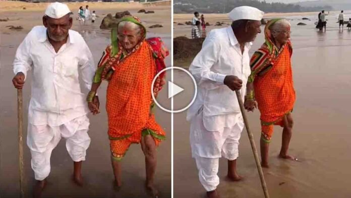 Elderly Indian grandparents holding hands while seeing the sea for the first time, an emotional moment captured in a viral video