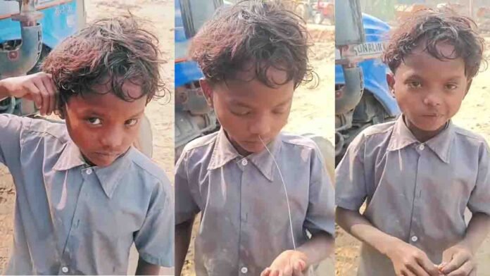 Village boy performing a shocking physical stunt by pulling a wire from his nose after inserting it in his ear, viral social media talent video from rural India.
